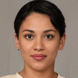 Joyful latino young-adult female with short  brown hair and brown eyes