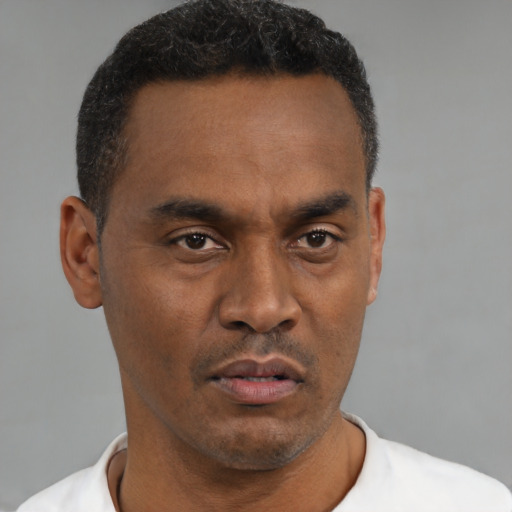 Neutral black young-adult male with short  black hair and brown eyes
