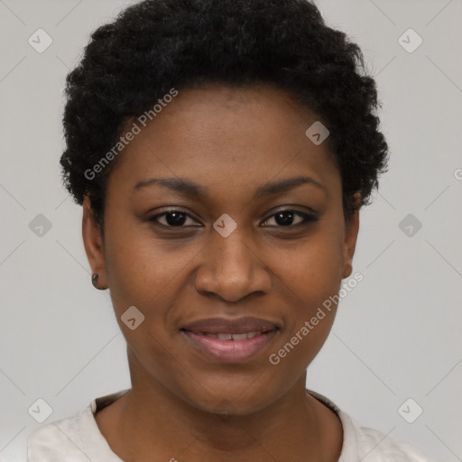 Joyful black young-adult female with short  black hair and brown eyes