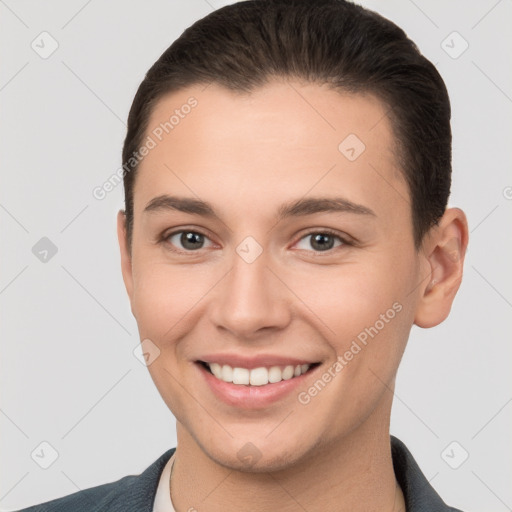 Joyful white young-adult female with short  brown hair and brown eyes