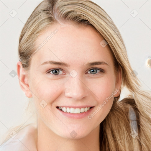 Joyful white young-adult female with long  brown hair and blue eyes