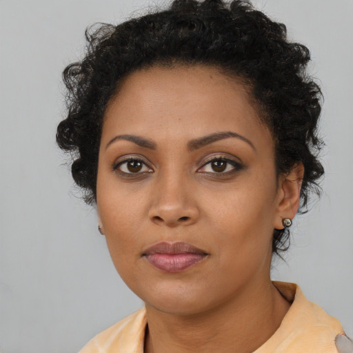 Neutral black young-adult female with short  black hair and brown eyes
