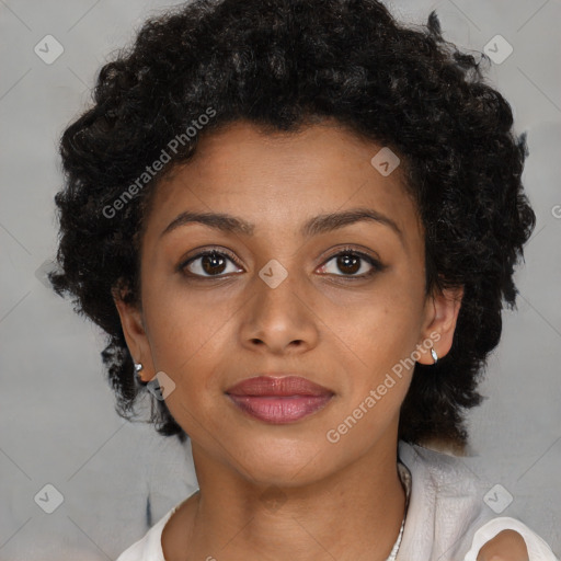 Joyful black young-adult female with short  brown hair and brown eyes