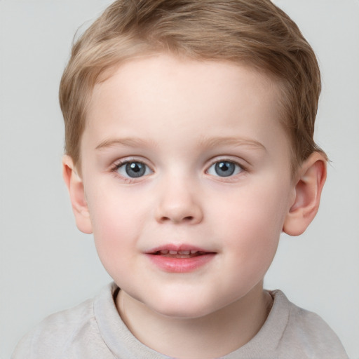 Joyful white child female with short  brown hair and blue eyes