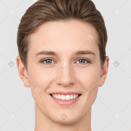 Joyful white young-adult female with short  brown hair and grey eyes