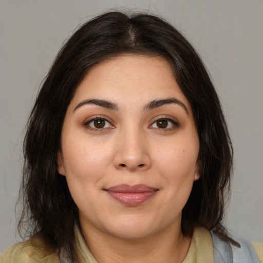 Joyful white young-adult female with medium  brown hair and brown eyes