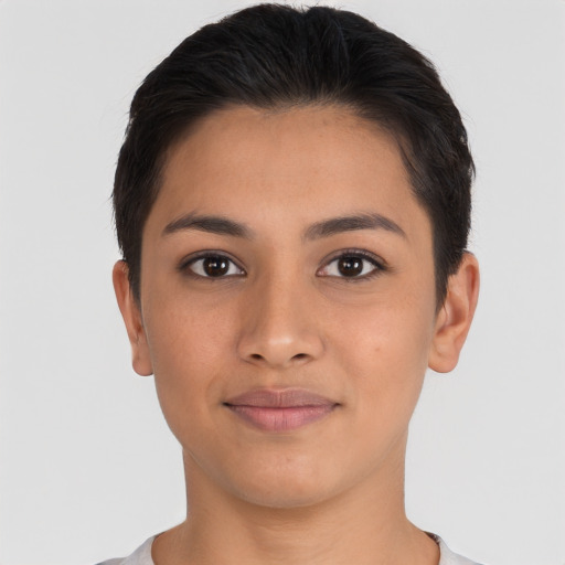 Joyful latino young-adult female with short  brown hair and brown eyes