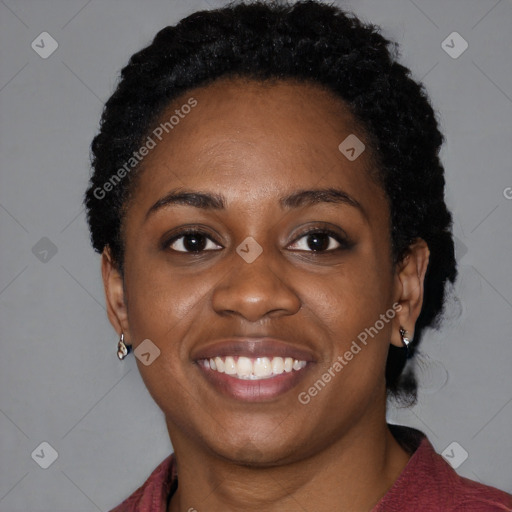 Joyful black young-adult female with medium  black hair and brown eyes