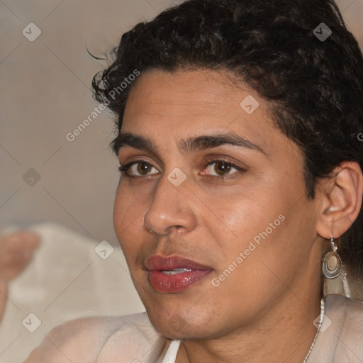 Joyful latino young-adult male with short  brown hair and brown eyes