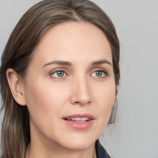 Joyful white young-adult female with medium  brown hair and blue eyes