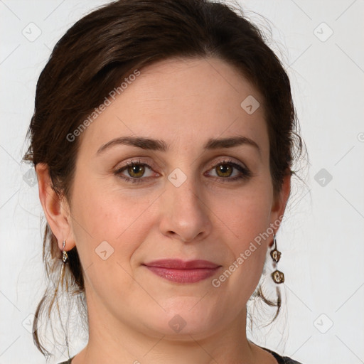 Joyful white young-adult female with medium  brown hair and green eyes