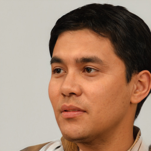 Neutral white young-adult male with short  black hair and brown eyes