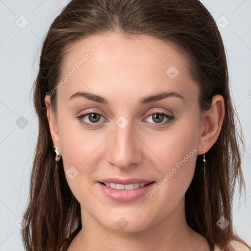 Joyful white young-adult female with long  brown hair and grey eyes