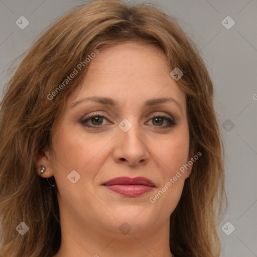 Joyful white adult female with medium  brown hair and green eyes