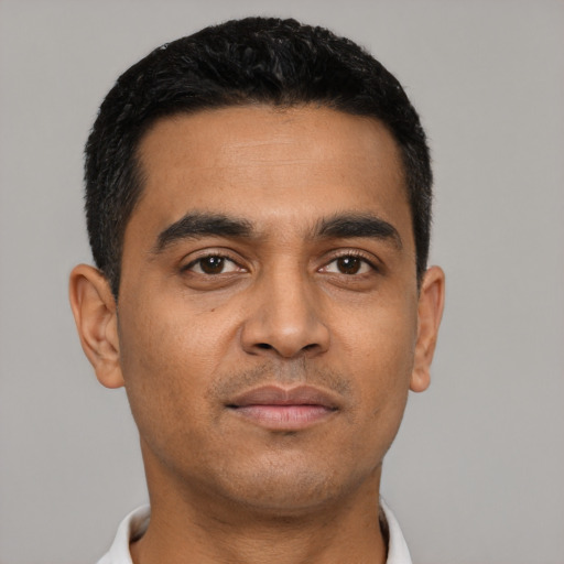 Neutral latino young-adult male with short  black hair and brown eyes