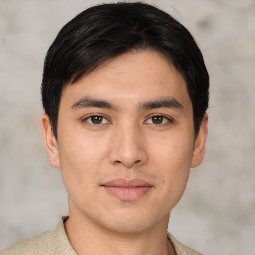 Joyful asian young-adult male with short  brown hair and brown eyes