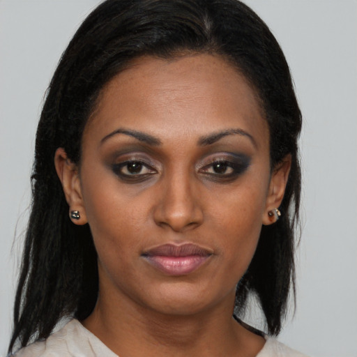 Neutral black adult female with medium  brown hair and brown eyes