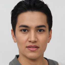 Joyful asian young-adult male with short  brown hair and brown eyes