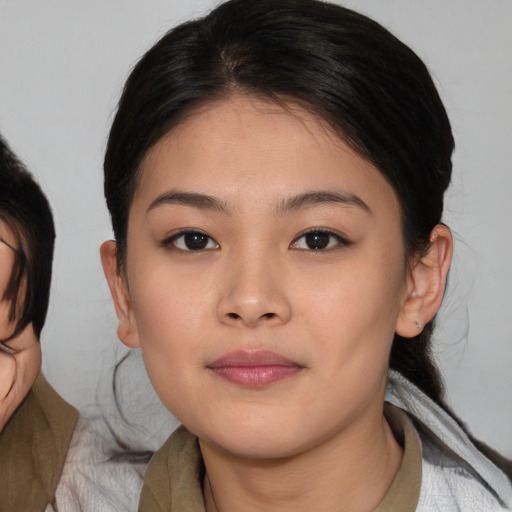 Neutral asian young-adult female with medium  brown hair and brown eyes