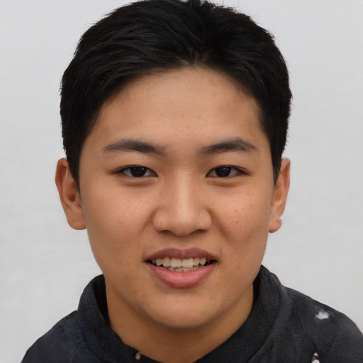 Joyful asian young-adult female with short  black hair and brown eyes