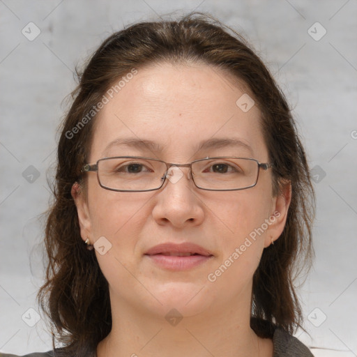 Joyful white adult female with medium  brown hair and grey eyes