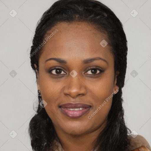 Joyful black young-adult female with long  black hair and brown eyes