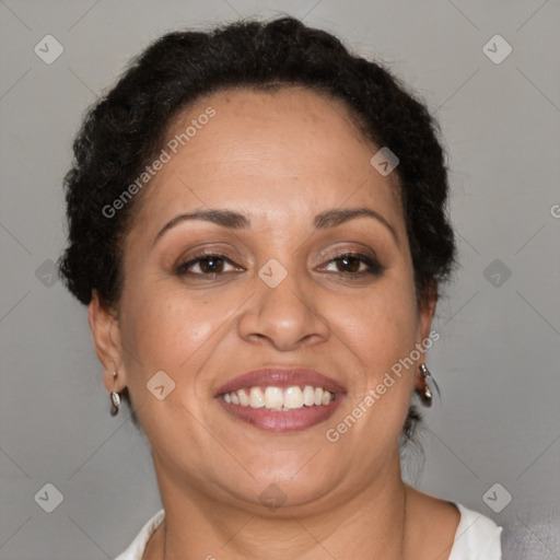 Joyful latino adult female with short  brown hair and brown eyes