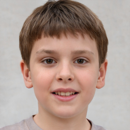 Joyful white child male with short  brown hair and brown eyes