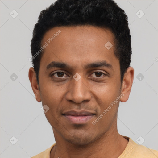 Joyful latino young-adult male with short  black hair and brown eyes