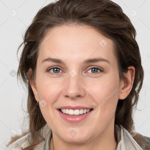 Joyful white young-adult female with medium  brown hair and grey eyes