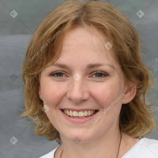 Joyful white young-adult female with medium  brown hair and blue eyes