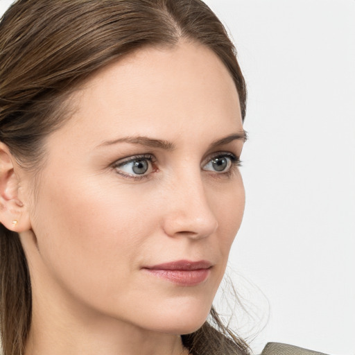 Neutral white young-adult female with long  brown hair and grey eyes