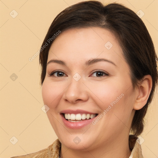 Joyful white young-adult female with long  brown hair and brown eyes