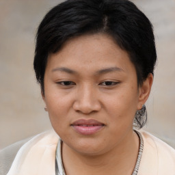 Joyful asian young-adult female with medium  brown hair and brown eyes