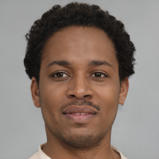Neutral black young-adult male with short  black hair and brown eyes