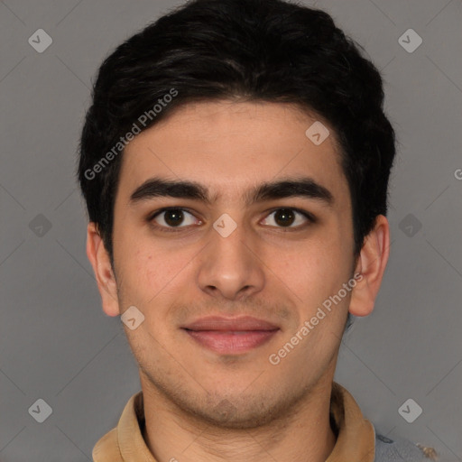 Joyful latino young-adult male with short  brown hair and brown eyes