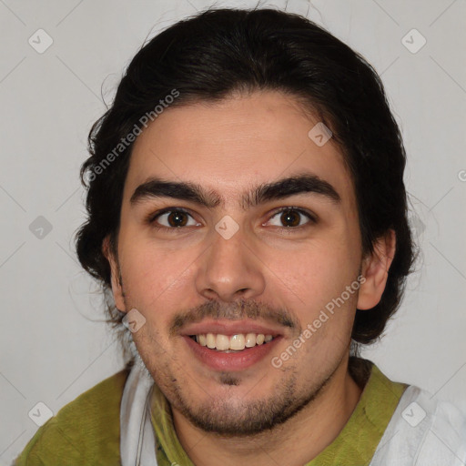 Joyful white young-adult male with medium  brown hair and brown eyes