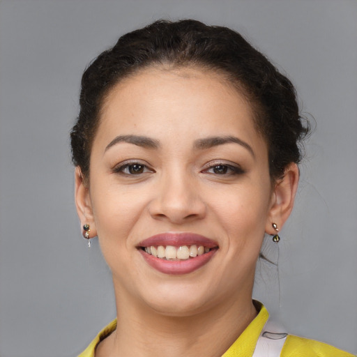 Joyful latino young-adult female with short  brown hair and brown eyes