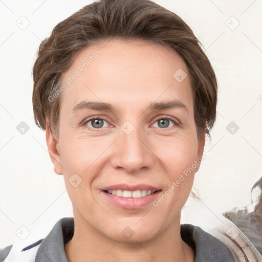 Joyful white young-adult female with short  brown hair and grey eyes