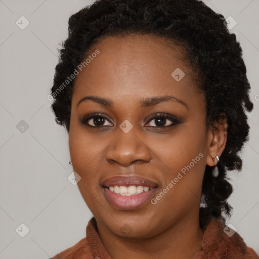 Joyful black young-adult female with long  brown hair and brown eyes