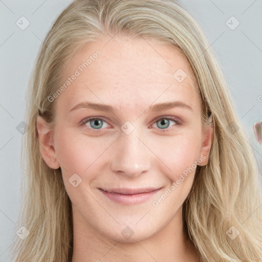 Joyful white young-adult female with long  brown hair and blue eyes