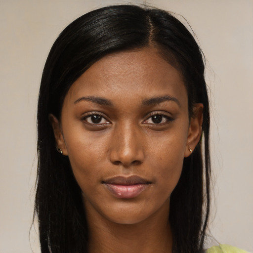 Neutral black young-adult female with long  brown hair and brown eyes