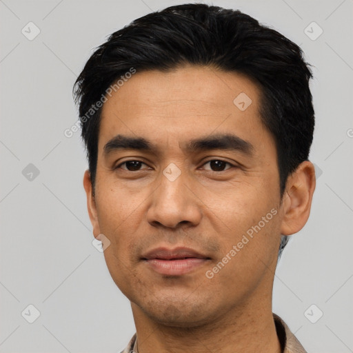 Joyful asian young-adult male with short  black hair and brown eyes