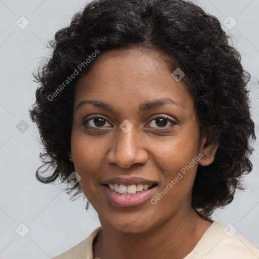 Joyful black young-adult female with long  brown hair and brown eyes