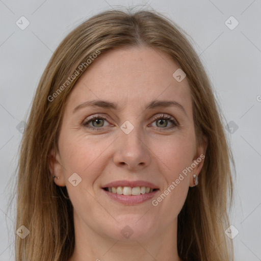 Joyful white young-adult female with long  brown hair and green eyes