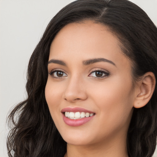 Joyful white young-adult female with long  black hair and brown eyes