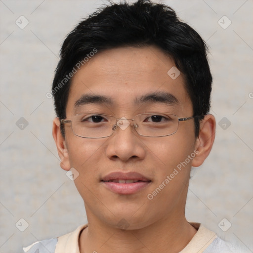 Joyful asian young-adult male with short  brown hair and brown eyes