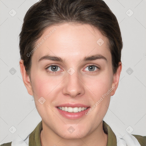 Joyful white young-adult female with short  brown hair and grey eyes