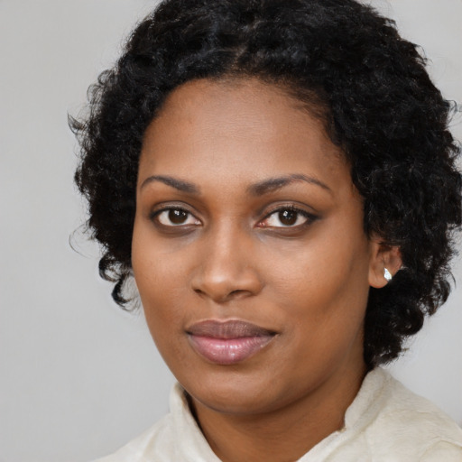 Neutral black young-adult female with medium  black hair and brown eyes