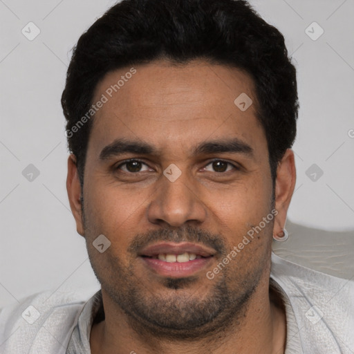 Joyful white young-adult male with short  black hair and brown eyes